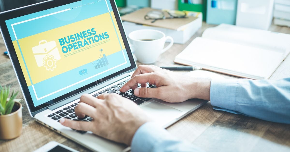 Hands typing on a laptop. Business operations concept on laptop screen.