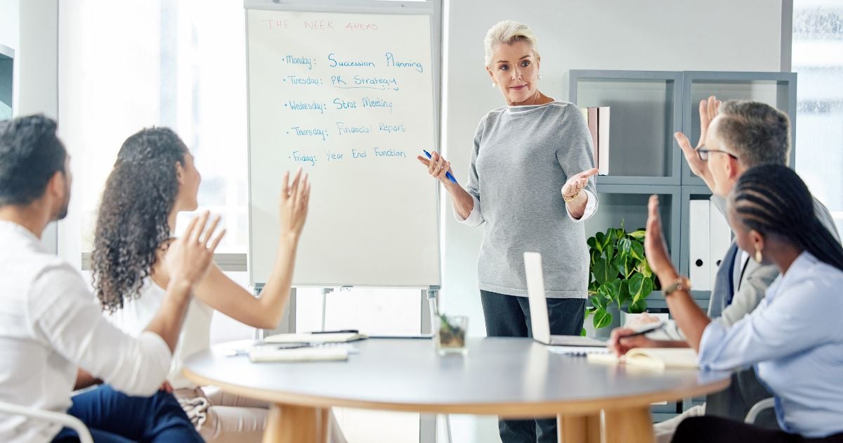 Shot of mature woman giving presentation to her colleagues
